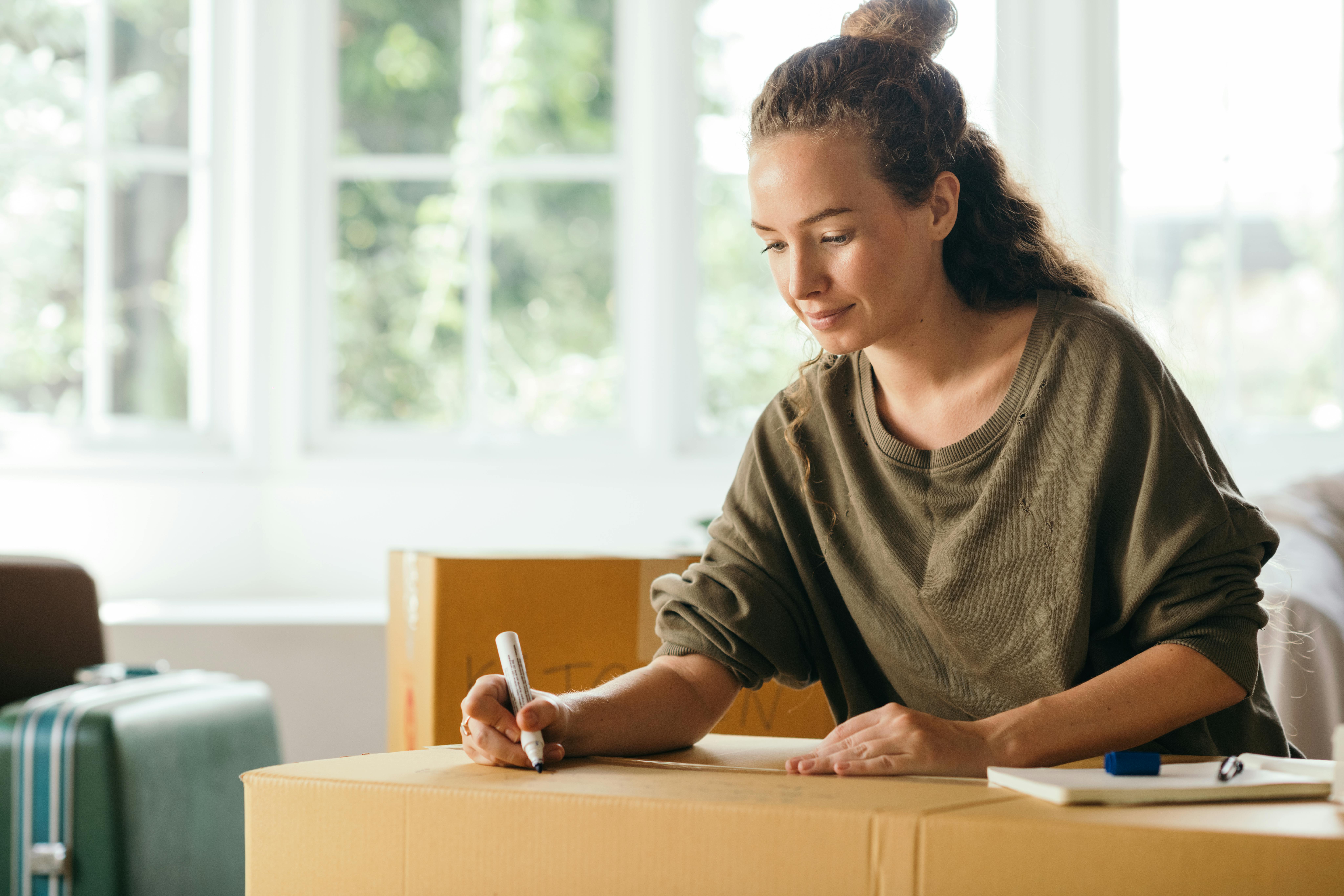 Woman packing boxes